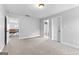 Large neutral bedroom, featuring neutral carpet and an access to an open hallway at 360 Grandmas Ln, Fayetteville, GA 30215