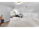 Spacious bonus room with neutral carpet, perfect for an office or hobby area at 360 Grandmas Ln, Fayetteville, GA 30215