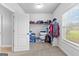 Walk-in closet features window and shelving at 360 Grandmas Ln, Fayetteville, GA 30215