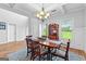 Elegant dining room with coffered ceiling, classic chandelier, and a large wooden table at 360 Grandmas Ln, Fayetteville, GA 30215