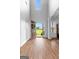 Spacious foyer with hardwood floors, open front door, and a view of the outdoors at 360 Grandmas Ln, Fayetteville, GA 30215