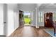 Bright foyer with hardwood floors, an open door, and a view of the front yard at 360 Grandmas Ln, Fayetteville, GA 30215
