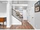 Grand foyer featuring a staircase, dark wood floors, and an open layout at 360 Grandmas Ln, Fayetteville, GA 30215