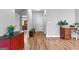 Hallway with a built-in desk area, wood floors, and access to other rooms at 360 Grandmas Ln, Fayetteville, GA 30215