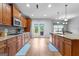 Gourmet kitchen with granite countertops, stainless steel appliances, and double french doors at 360 Grandmas Ln, Fayetteville, GA 30215