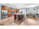 Open kitchen features an island with seating, stainless appliances, and a breakfast nook at 360 Grandmas Ln, Fayetteville, GA 30215