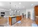 Open kitchen with large island and seating, walk-in pantry, and stainless appliances at 360 Grandmas Ln, Fayetteville, GA 30215