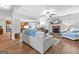 Open-concept living room featuring a fireplace, hardwood floors, and modern furnishings at 360 Grandmas Ln, Fayetteville, GA 30215