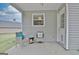 Cozy covered back patio with seating, ideal for relaxing outdoors at 131 Meadowbrook Ln, Grantville, GA 30220