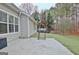The backyard features a grill on the concrete patio, perfect for barbecues at 131 Meadowbrook Ln, Grantville, GA 30220