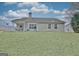 View of the home's backyard and outdoor patio, great for outdoor living at 131 Meadowbrook Ln, Grantville, GA 30220