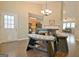 Cozy dining area featuring a stylish table with bench seating and wood floors at 131 Meadowbrook Ln, Grantville, GA 30220