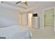 Bedroom with carpet, ceiling fan, and walk-in closet access at 131 Meadowbrook Ln, Grantville, GA 30220
