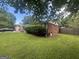 The property shows a well-maintained lawn, some foundation plantings, and partial brick facade at 3885 Morning Creek Dr, South Fulton, GA 30349