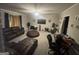 Cozy living room with neutral walls, plush seating, and a ceiling fan at 3885 Morning Creek Dr, South Fulton, GA 30349