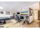 Basement area with a bar, stools, small refrigerator, and TV at 6230 S Summers Cir, Douglasville, GA 30135