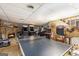 Finished basement features arcade games, ping pong table, and a stone fireplace at 6230 S Summers Cir, Douglasville, GA 30135