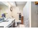 Bathroom with a single vanity, toilet, shower with decorative curtain, and clock at 6230 S Summers Cir, Douglasville, GA 30135