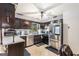 Functional kitchen featuring stainless steel appliances, dark cabinetry, and practical countertops at 6230 S Summers Cir, Douglasville, GA 30135
