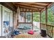 Screened porch with swing, lighting, and brick exterior at 6230 S Summers Cir, Douglasville, GA 30135