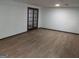 Open basement area with new floors and french doors at 205 Avon Dr, Fayetteville, GA 30215