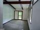 Bright bedroom featuring neutral carpet, white walls, and a sliding door to the outdoors at 205 Avon Dr, Fayetteville, GA 30215