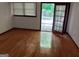 Bright living room with hardwood floors and door leading to the outdoor pool area at 205 Avon Dr, Fayetteville, GA 30215