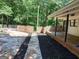Inviting backyard showcasing a stone-paved patio and a refreshing in-ground pool, perfect for relaxation at 205 Avon Dr, Fayetteville, GA 30215