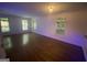 Bright, spacious living room with hardwood floors and plenty of natural light from multiple windows at 241 Perimeter Walk, Atlanta, GA 30338