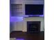 Cozy living room boasts a fireplace, built-in shelving, and ambient lighting at 241 Perimeter Walk, Atlanta, GA 30338