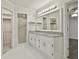 Bathroom featuring double sinks with granite counter and tiled floor at 107 Jennings Yard, Peachtree City, GA 30269