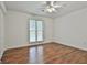 Empty bedroom with wood floor, ceiling fan and window with outside view at 107 Jennings Yard, Peachtree City, GA 30269