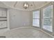 Cozy breakfast nook illuminated by natural light streaming through windows, complemented by neutral tones and tile flooring at 107 Jennings Yard, Peachtree City, GA 30269