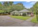 Beautiful home featuring a covered front porch, well-maintained landscaping, and a spacious driveway at 107 Jennings Yard, Peachtree City, GA 30269