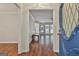 Inviting foyer with hardwood floors flowing into a spacious living area with ample natural light from windows at 107 Jennings Yard, Peachtree City, GA 30269