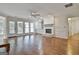 Spacious living room features hardwood floors, fireplace, built-in storage, and natural light streaming through the windows at 107 Jennings Yard, Peachtree City, GA 30269