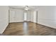 Living room with wood floors, multiple entries, and ceiling fan at 107 Jennings Yard, Peachtree City, GA 30269