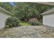 Flagstone patio with view of mature plantings in backyard at 107 Jennings Yard, Peachtree City, GA 30269