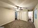 This bedroom has neutral walls, soft carpet, ceiling fan, and en suite bathroom at 604 Thomasville Blvd, Atlanta, GA 30315