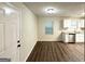 Dining area with stainless steel appliances, view of kitchen and hardwood floors at 604 Thomasville Blvd, Atlanta, GA 30315