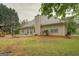 The house backyard has a nice lawn, some trees and a gazebo at 1917 Kevin Se Dr, Conyers, GA 30013