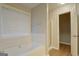 Bathroom with a soaking tub, stand up shower, and natural light at 1917 Kevin Se Dr, Conyers, GA 30013