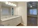 Well-lit bathroom with a double vanity and granite countertop at 1917 Kevin Se Dr, Conyers, GA 30013