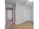 A spacious bedroom boasts wood-look floors, a closet, and an open doorway to the rest of the home at 1917 Kevin Se Dr, Conyers, GA 30013