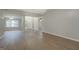 Spacious living room featuring vaulted ceilings, wood floors and a large front window for abundant natural light at 1917 Kevin Se Dr, Conyers, GA 30013