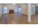 Spacious living room featuring a brick fireplace, natural light, and neutral paint colors at 1917 Kevin Se Dr, Conyers, GA 30013