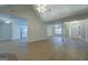 Large living room with an open layout, hardwood floors, and a view of the entry and kitchen at 1917 Kevin Se Dr, Conyers, GA 30013