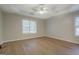 Bright main bedroom featuring a trey ceiling and a large window with natural light at 1917 Kevin Se Dr, Conyers, GA 30013