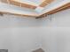 Walk-in closet featuring wooden shelving and a hanging rod for organization at 1001 Stagecoach Rd, Stockbridge, GA 30281