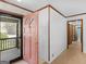 Welcoming foyer featuring tile floors, a pink front door and view to the porch at 1001 Stagecoach Rd, Stockbridge, GA 30281